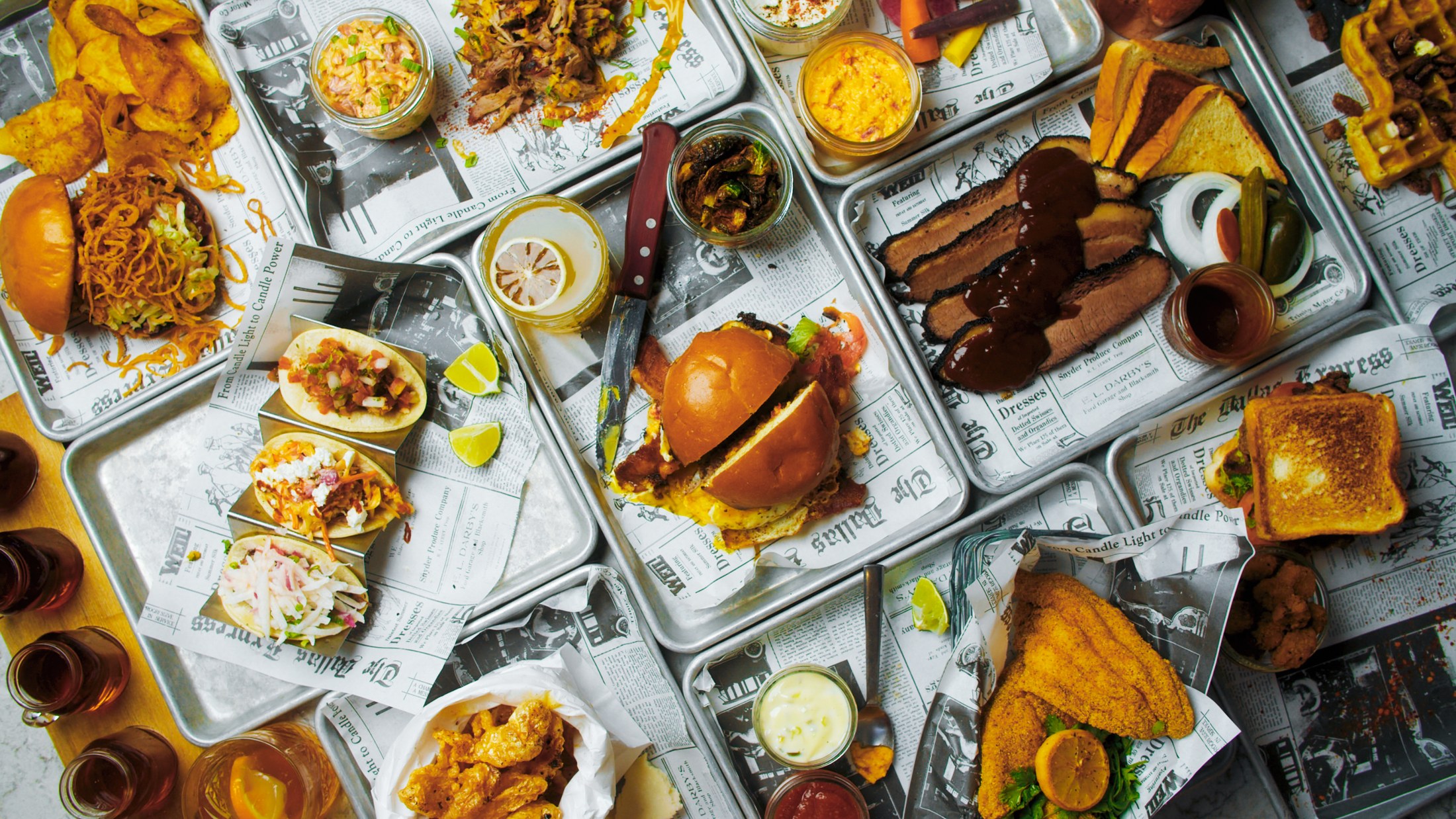 A spread of Seely’s Mill barbecue, sandwiches, tacos, and drinks